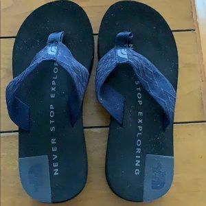 The North Face Blue and Black Flip Flops